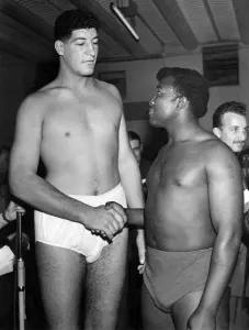 Ewart Potgieter, the 7ft. 2 in. 22 stone south african, Shakes hands with simon templar