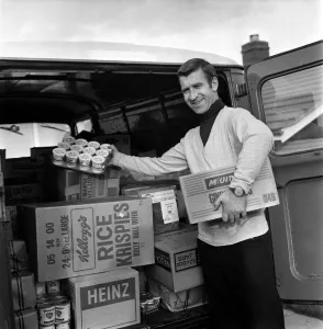 Stalls Prints: Ex Blackburn and England winger Bryan Douglas loading his grocery van ready for a day