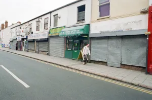 00839 Prints: Examples of shuttered and non-shuttered shops on Far Gosford Street