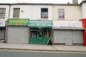 00839 Prints: Examples of shuttered and non-shuttered shops on Far Gosford Street