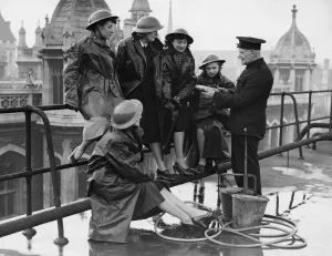 Instruction Prints: Explaining the composition of an incendiary bomb to office girls of a city company who