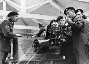 01433 Prints: An explanation of the details of an anti-tank gun being given to members of a West