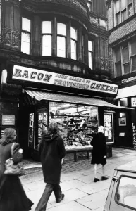 Places Prints: Exterior view of John Allen and Co. Cheese shop in Cateaton Street