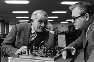Board Games Prints: Eyeball to eyeball confrontation across the chess board for Clifford Evans, left