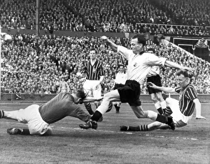 FA Cup Final May 5th 1956. Manchester City keeper Trautmann dives bravely at the feet of
