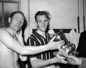 00337 Prints: FA Cup Final at Wembley. Manchester City players Bert Traumann and Don Revie with the Cup