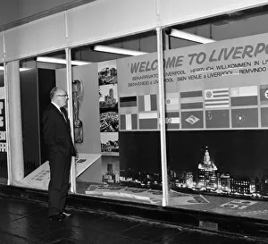 Tournament Prints: FA Secretary Mr Denis Follows looking at greeting sign in Liverpool ahead of the 1966