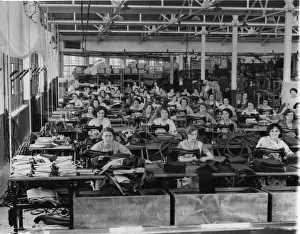 Textiles Prints: A factory scene in 1935 showing women and their Singer sowing machines