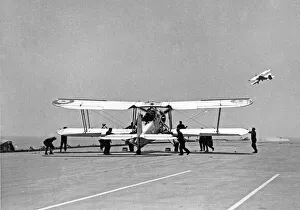 Warships Prints: Fairey Swordfish planes launch from the flight deck of the Royal Navy Aircraft Carrier
