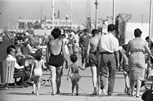 Holidaymaker Prints: Families on a day trip from the East End of London soak up the summer sunshine