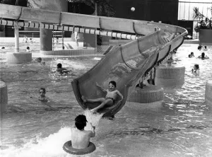Swimming Prints: Families enjoying the water slide at Temple Park Leisure Centre in South Tyneside