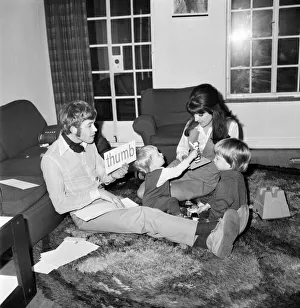 Families: Mother, father and children. Mother, father and children all playing