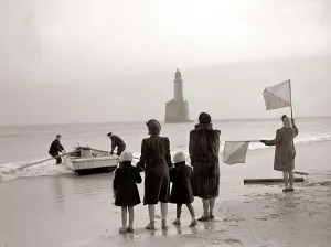 The families of the Rattray Head lighthouse keepers semaphore their loved ones as Old