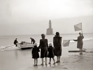 The families of the Rattray Head lighthouse keepers semaphore their loved ones as Old