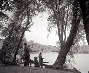Forest Prints: a family out in the countryside, fishing on the bank of a lake 1953 1950s day out