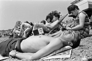 Holidaymaker Prints: A family of day trippers from London, soaking up the summer sun whilst listening to music