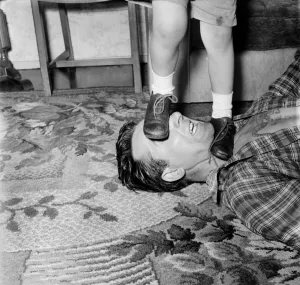 00041 Prints: Familys: Voilence. Stuntman Steve Donohue seen here having a Mock Fight with his daughter