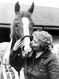 Owner Prints: famous Racehorse Corbiere, winner of the 1983 Grand National is kissed by his happy