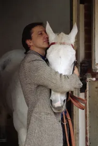 Famous racehorse Desert Orchid in his stables with owner Richard Burridge