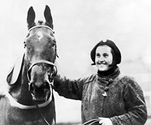 Famous racehorse Golden Miller with owner Dorothy Paget after winning the 1934 Grand