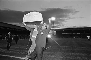 A fan jumps into the arms of Sunderland manager Bob Stokoe during the homecoming