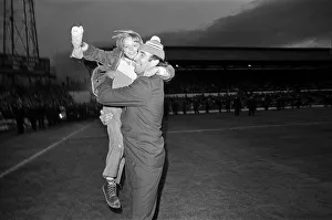 01225 Prints: A fan jumps into the arms of Sunderland manager Bob Stokoe during the homecoming