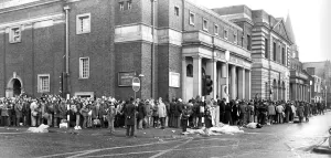 00086 Prints: Fans of Genesis queueing up outside Newcastle City Hall for tickets