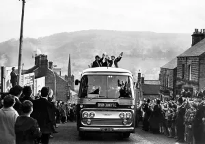 Fans line the streets as the Derby County team arrive in Matlock on their way to