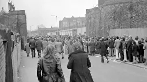 Fans queue up outisde The Den, home of Millwall football club