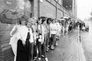 Fans queue outside football ground ahead of Duran Duran Concert at Villa Park, Birmingham