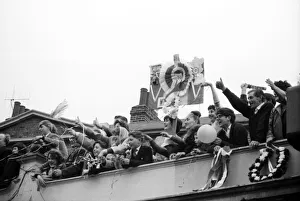 00209 Prints: Fans of Tottenham Hotspur wave and cheer as their team arrive home after defeating