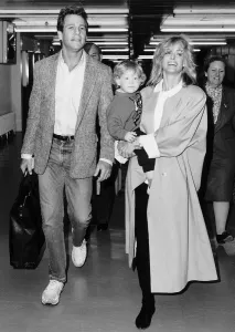 00144 Prints: Farrah Fawcett Actress with her family fying out of Heathrow April 1987
