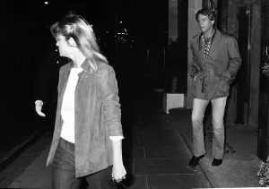 Farrah Fawcett Majors with boyfriend Ryan O Neal 1980 walking out of Claridges