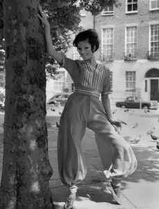 00031 Prints: Fashion 1960 s. Stevie Whittington in a Ali Baba Harem suit in tangerine