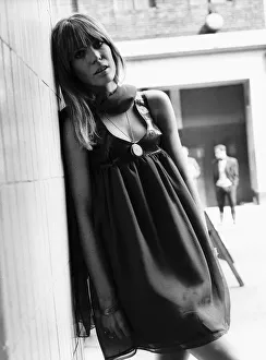 Fashion 1960s designed by Ossie Clark worn by model Suki Poitier Leaning against