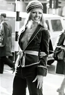 Fashion 1970s Model wearing a purple velvet Knickerbocker suit