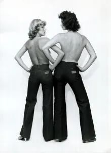 Bare Chested Prints: Fashion 1970s Models wearing Wrangler flared jeans, linking arms