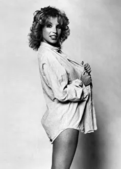 Fashion - 1970s. How to give an old prison shirt a new look - put a dolly bird