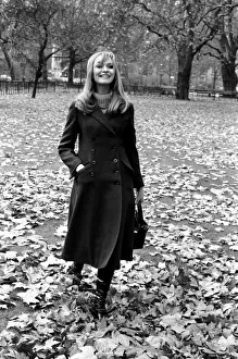 Fashion Clothing. Woman Model: Blanche Webb wearing the midi coat