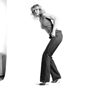 Images Dated 6th January 1981: Fashion: Clothing: A woman pulling up a pair of denim jeans. January 1981 81-00051-006