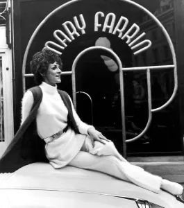 Fashion designer Mary Farrin wearing her own white knitted angora dress over matching