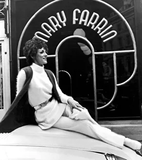 Fashion designer Mary Farrin wearing her own white knitted angora dress over matching