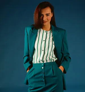 Striped Prints: Fashion female suits 1988 Model wearing turquoise suit