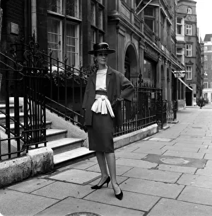 Fashion model Mignon Madden models clothes designed by Graham Smith Wearing a hat