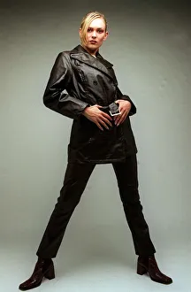00181 Prints: Fashion A model wearing black leather jacket and trousers 1996