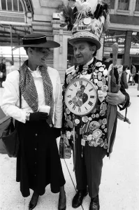 1980s Fashion Prints: Fashion at Royal Ascot - June 1987 man wearing a large clock around his neck