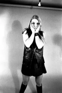 00113 Prints: A fashion shoot from 13 April 1970 - A model wears a dress with knee lenght boots