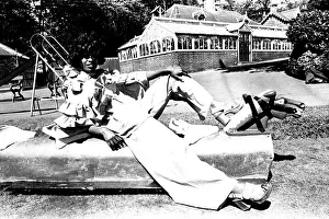 00113 Prints: A fashion shoot from 30 May 1972 - A model wears flared trousers and platform shoes