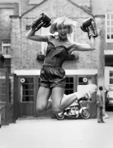 Fashion - Shorts: Knockout. Model Jane Sturdy wears shorts and a basque top