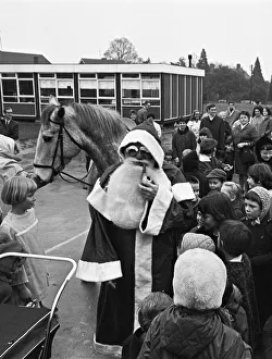 Father Christmas arrives on horseback at Woodley School 30th November 1968